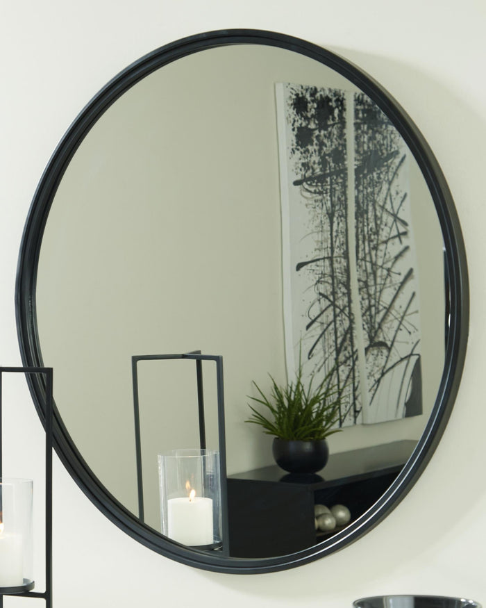 Round wall mirror with black rim and reflective glass
