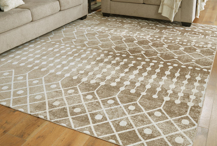 Beige area rug with white geometric symbols and lattice pattern across the surface