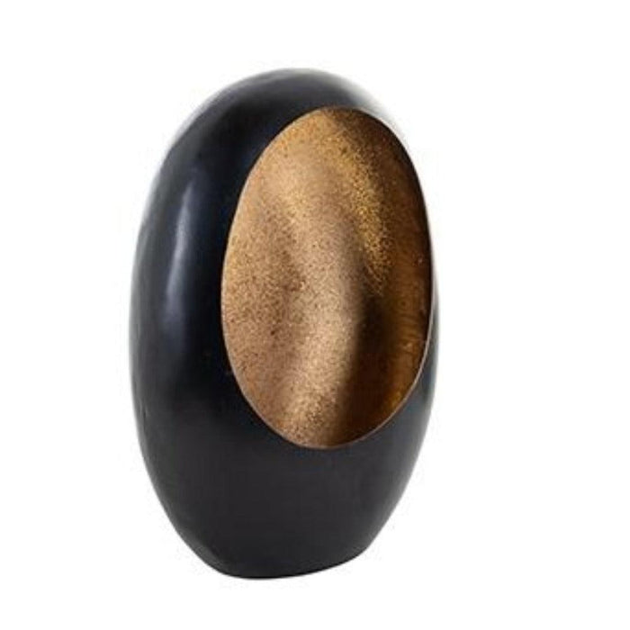 Black Civan candle holder with gold glitter interior, oval shape, modern design.
