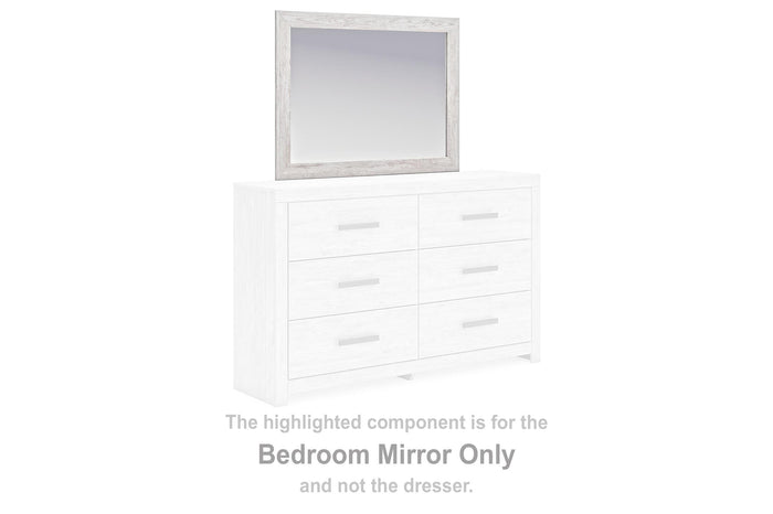 Rectangular bedroom mirror with light frame, shown above a white dresser