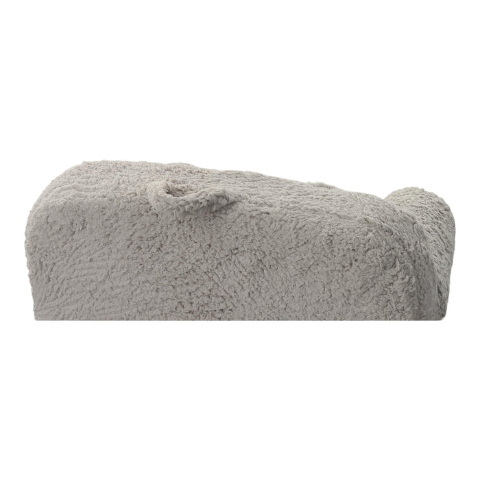 Grey sherpa chair side profile with thick cushions and rounded corner detailing