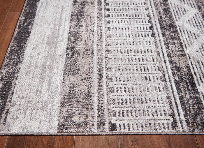 Gray and white geometric striped area rug with tall vertical bands and center stripe