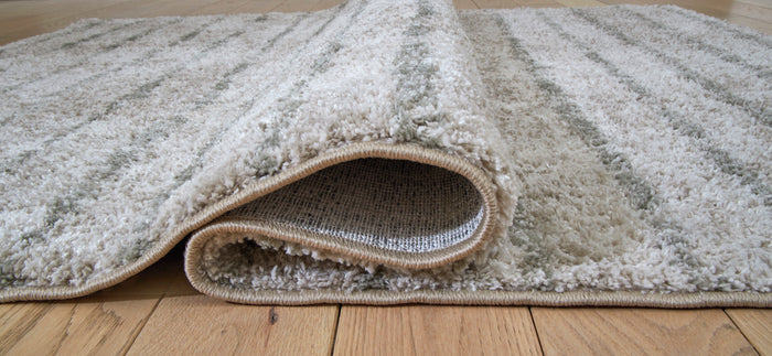 5x7 area rug with textured short pile, gray-and-ivory mottled stripes