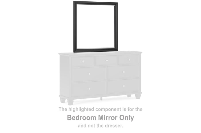 Bedroom mirror with a black rectangular frame, set above a white dresser