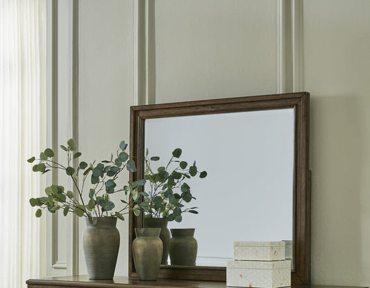 Bedroom mirror with weathered dark wood frame and rectangular glass panel