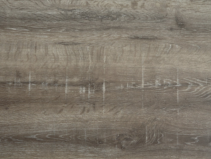 Gray wood tabletop close-up showing grain and light scuffs