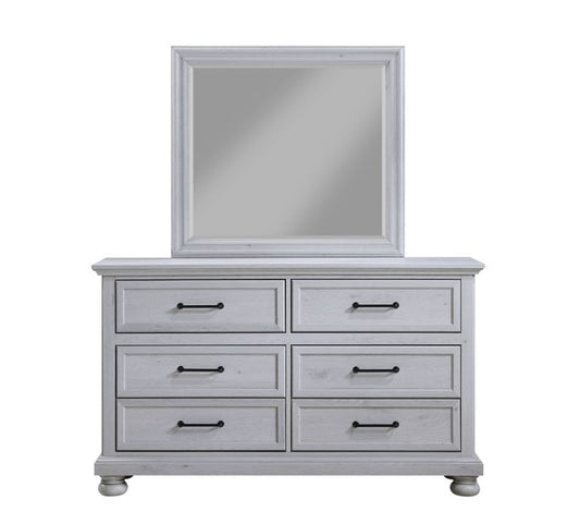 Bedroom mirror with dove gray frame on dresser with six drawers and black pulls