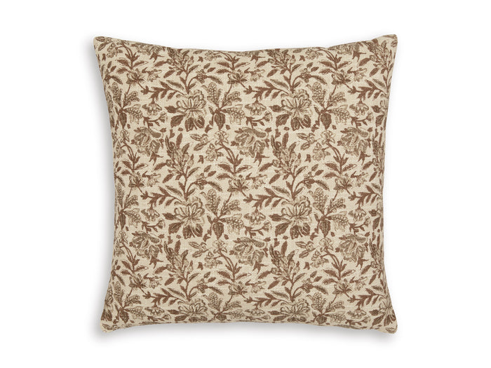 Square throw pillow with tan base and brown botanical leaf pattern.
