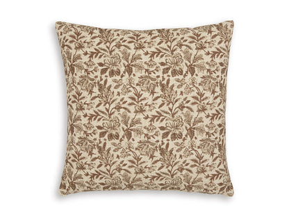 Square throw pillow with tan base and brown botanical leaf pattern.