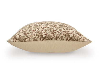 Floral-pattern throw pillow shown in profile, tan with brown leaf print.
