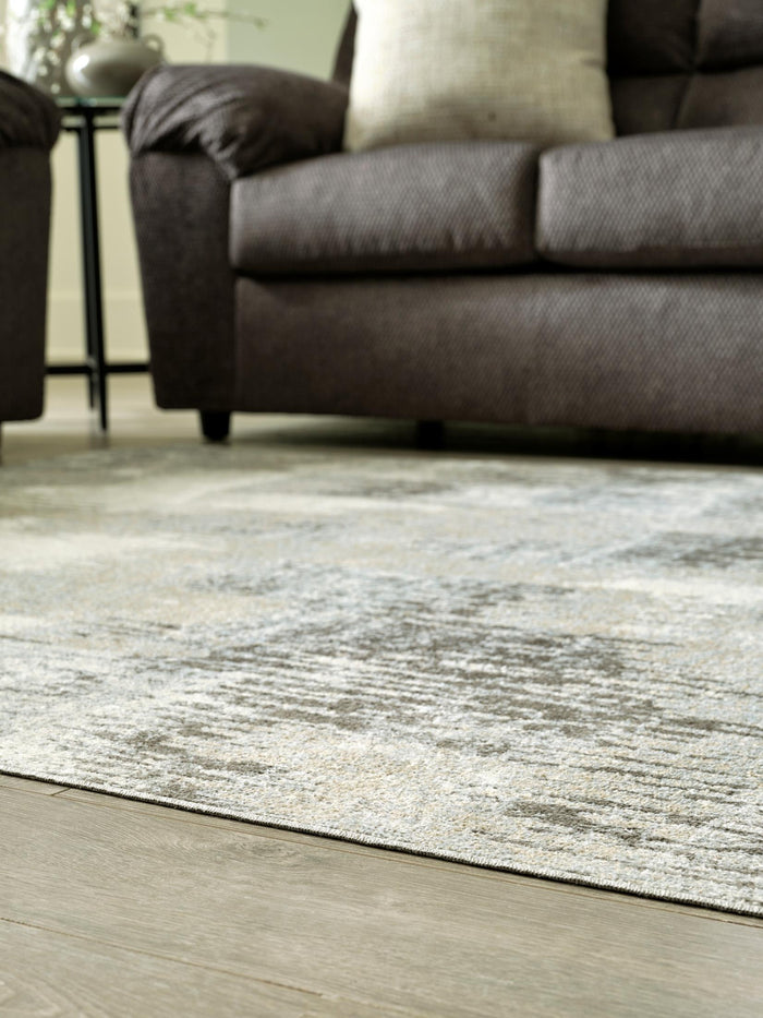 Light gray abstract area rug with ivory highlights and low-profile textured surface