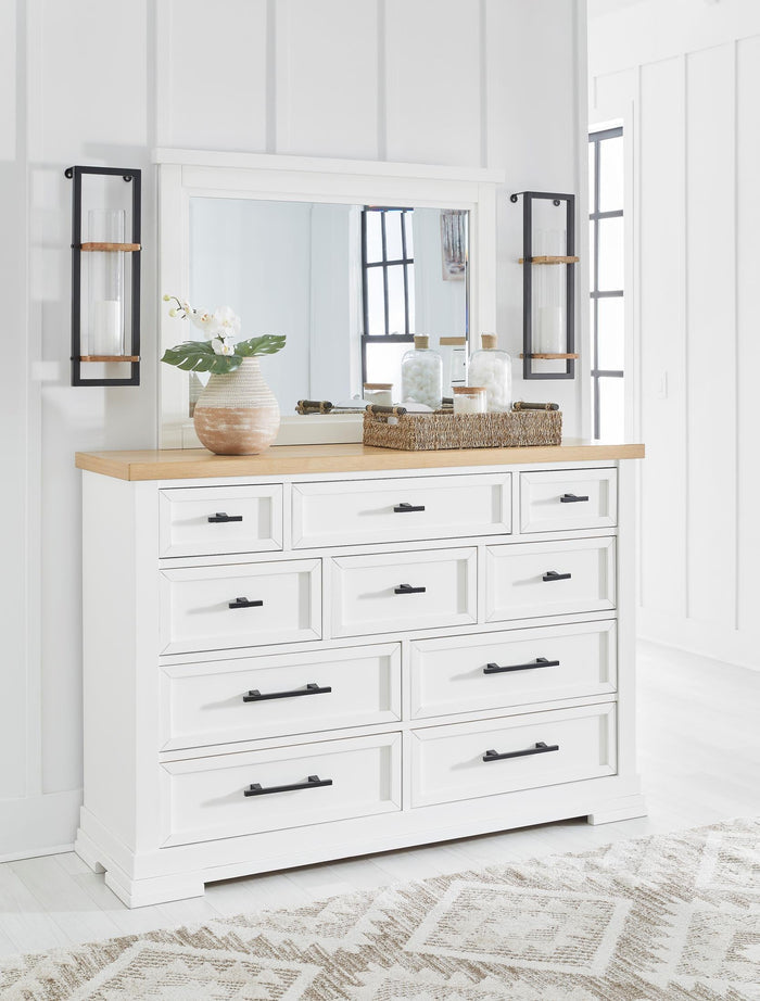 Black-framed rectangular bedroom mirror with thin metal border