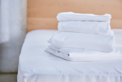 White organic cotton pillowcase stack with smooth folded fabric