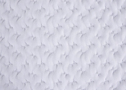 Pillow fabric close-up, white textured wavy quilting
