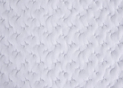 White textured quilted pillow fabric close-up