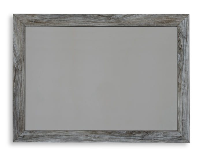 Light gray wood-framed bedroom mirror with rectangular beveled edges