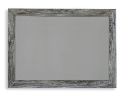 Light gray wood-framed bedroom mirror with rectangular beveled edges