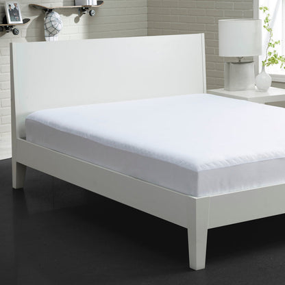 White fitted mattress protector on bed, showing front edge and smooth corner folds