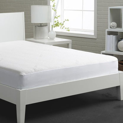 White mattress protector with textured top fabric, fully covering the mattress
