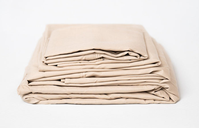 Khaki microplush sheet set folded stack with smooth, plush-like fabric