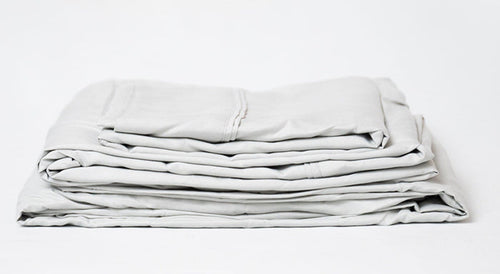 Pewter split head king sheet set, folded stack of soft microfiber sheets with stripes