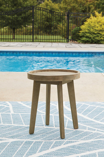 Round wooden end table with flat round top and four straight legs