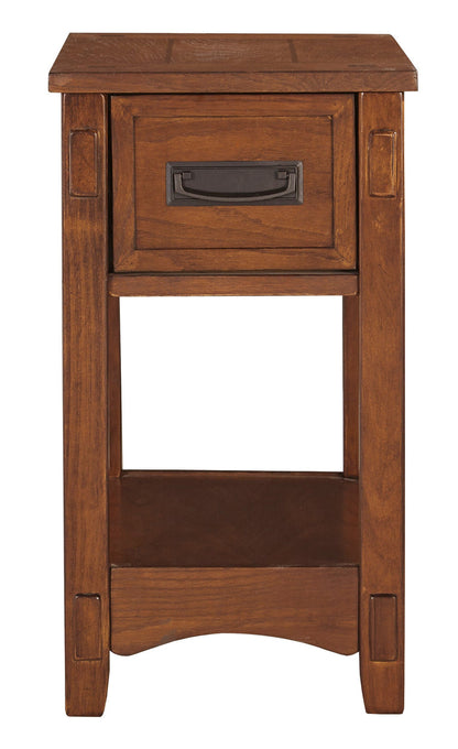 Cherry chairside end table with drawer, dark metal pull, and lower open shelf.