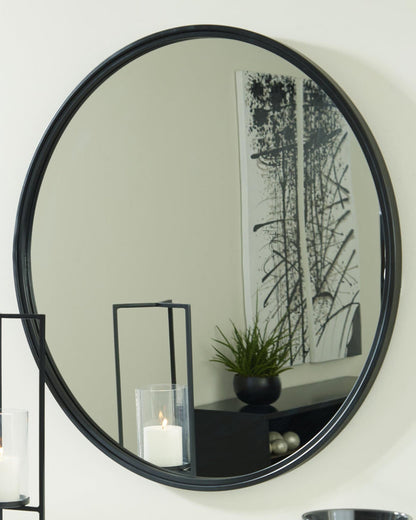Round wall mirror with black rim and reflective glass