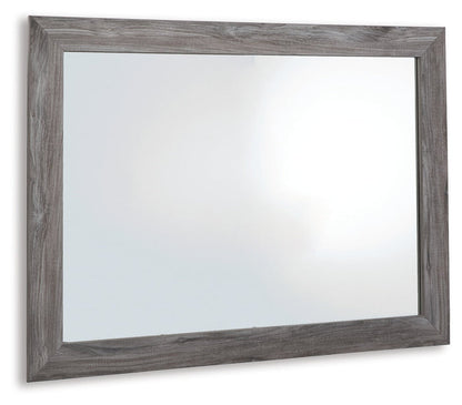 Rectangular bedroom mirror with distressed gray wood frame and clear glass