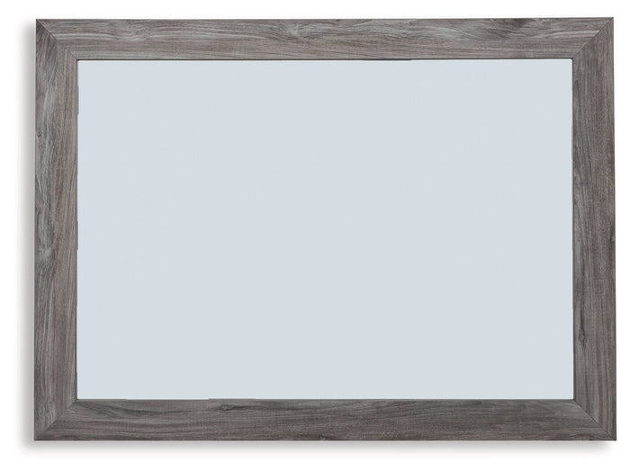 Rectangular bedroom mirror with distressed gray wood frame and reflective glass