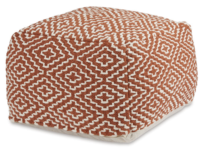Orange geometric pouf with diamond and cross pattern, rounded cube shape.