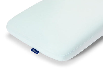 Light blue Casper hybrid snow pillow corner close-up, smooth foam surface and seam line