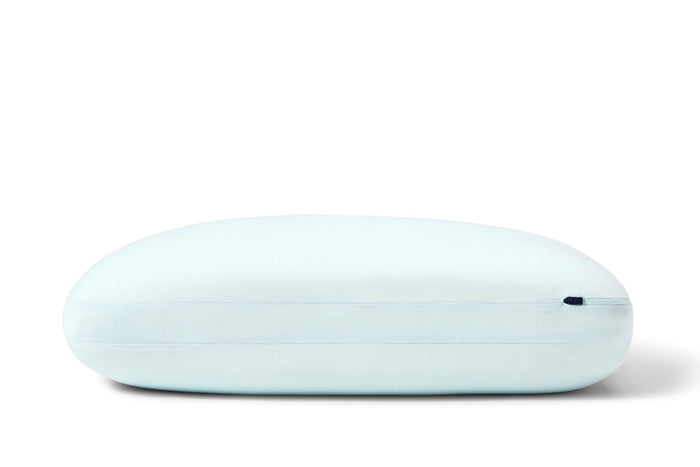Light blue Casper hybrid snow pillow, centered oval side view with subtle seam line