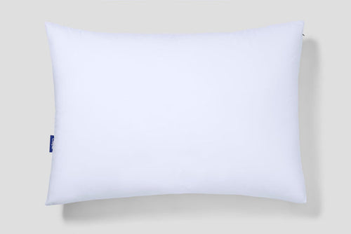 White rectangular pillow with blue Casper logo tag on left side.