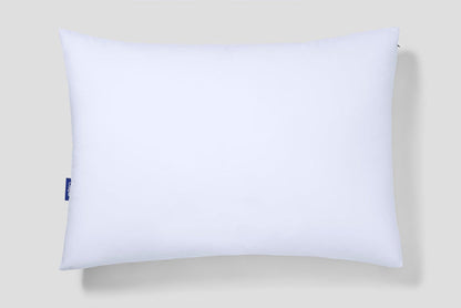 White rectangular pillow with a blue Casper logo patch on the left edge.