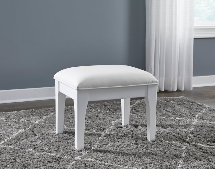 White vanity stool with rounded cushioned seat on four straight legs