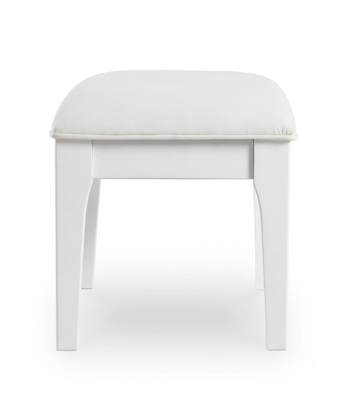 White vanity stool with rounded padded seat and four straight legs