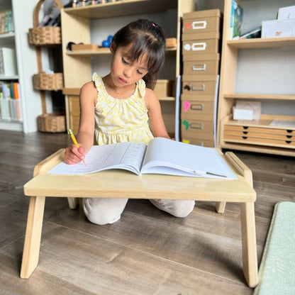 Girl drawing on the Chowki Table