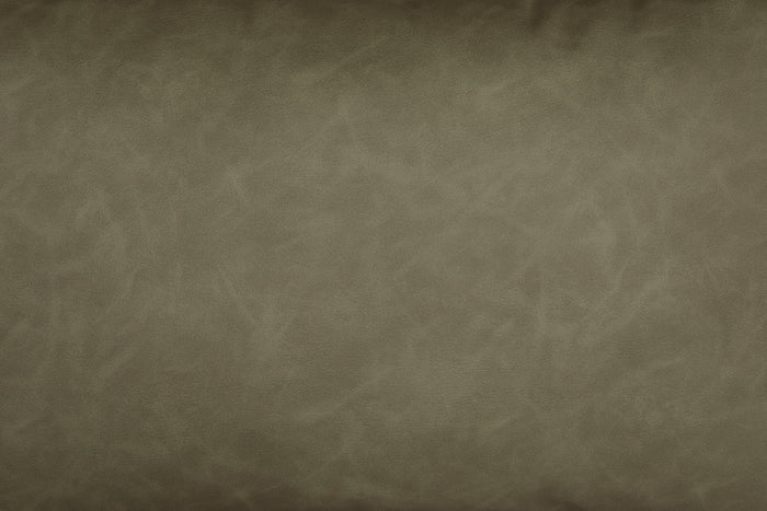 Close-up of sage green faux leather texture on a lumbar decorative pillow