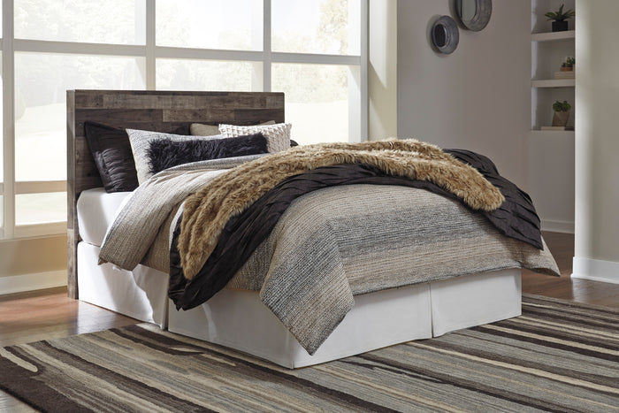 Upholstered-style panel headboard in dark wood finish behind white bed