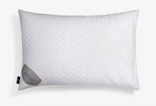 A white textured pillow with a subtle diamond pattern, featuring a gray fabric tag on the lower left corner with the brand name 'Air-X' in teal, set against a clean white background.