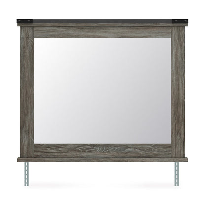 Rectangular bedroom mirror with weathered gray wood frame and two visible support legs