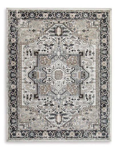 Geometric medallion area rug with black and light gray ornate border