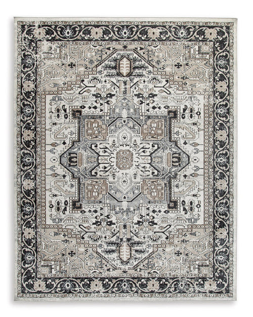 Geometric medallion area rug with black and light gray ornate border