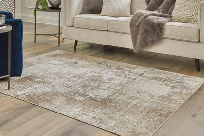 Light beige and ivory distressed rug, rectangular, shown on a living room floor.