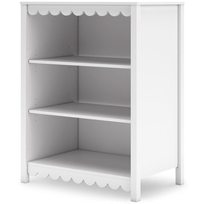 White bookcase side view with three open shelves and scalloped trim