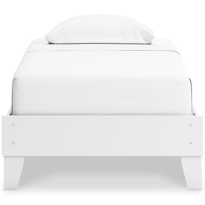 White platform bed front view with rounded headboard and centered pillows