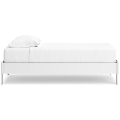 White platform bed side view with slatted frame and two pillows