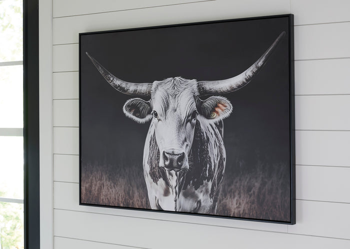 Framed black-and-white cow wall art print with horns and snout, wall-mounted.