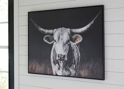 Framed black-and-white cow wall art print with horns and snout, wall-mounted.